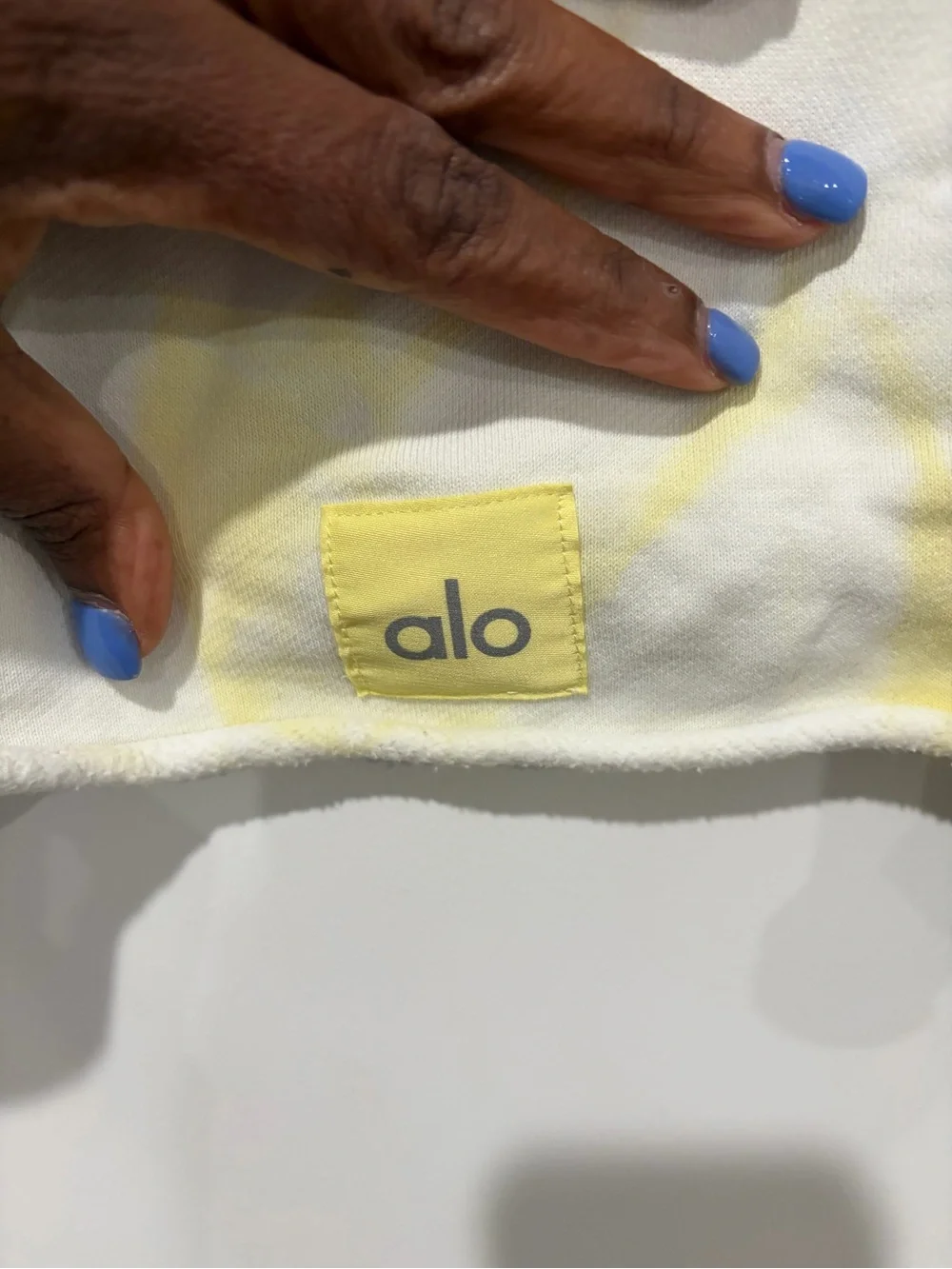 ALO Yoga Cropped Crewneck Sweatshirt in Pale Yellow Tie-Dye. Small stain